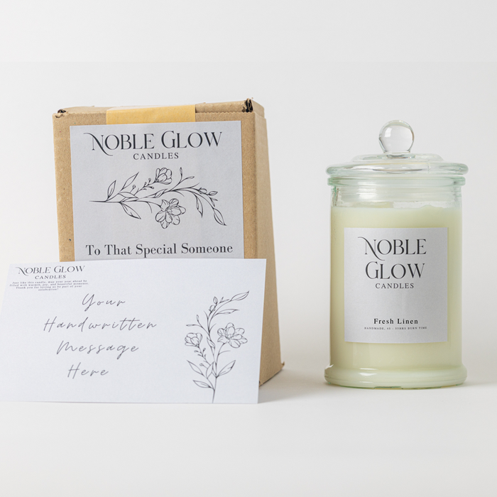Noble Glow candles with packaging and card on a white background